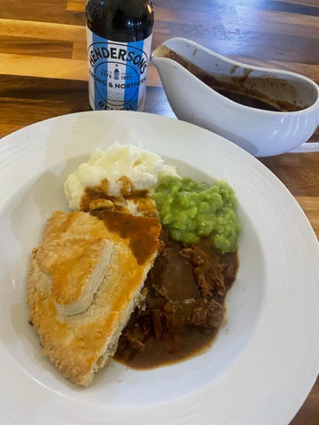Slow cooked Steak and Ale beef pie, served with mushy peas & mash (and lashings of hendos)